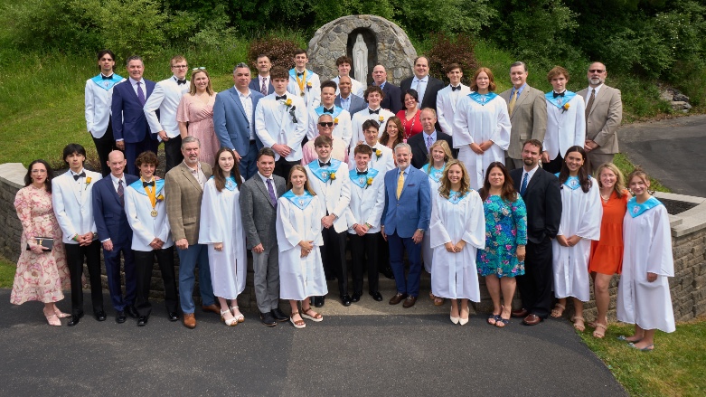 Twenty-one members of the Class of 2024 posed with their alumni moms and dads prior to graduation on June 2.